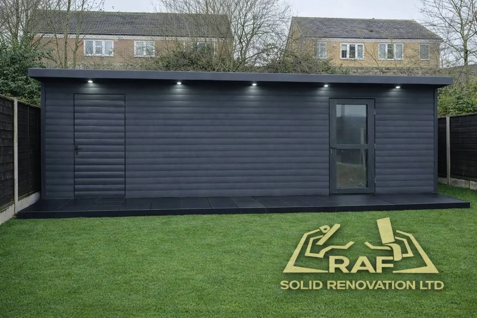Dark-clad garden building with downlights above a lawn, with the RAF Solid Renovation Ltd mark in the corner